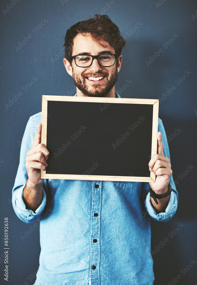 Glasses, portrait and man with chalkboard for mockup space with marketing, promotion or advertising. Happy, career and male teacher from Canada with sign for education isolated by studio background. Glasses, portrait and man with chalkboard for mockup space with marketing, promotion or advertising. Happy, career and male teacher from Canada with sign for education isolated by studio background.