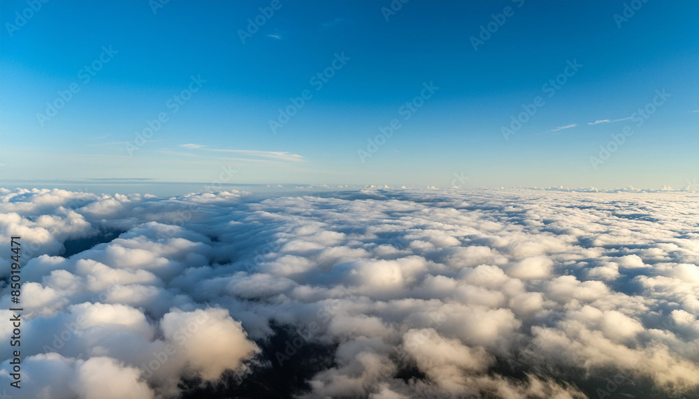 Fototapeta premium Flying through white clouds towards ground visible from distance