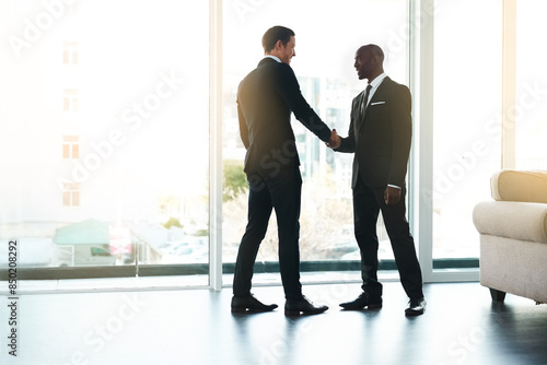 Handshake, introduction and business men in office with agreement for B2B deal, partnership or collaboration. Corporate, welcome and people shaking hands for onboarding, opportunity or recruitment © peopleimages.com