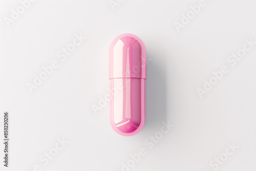 a pink pill on a white background photo