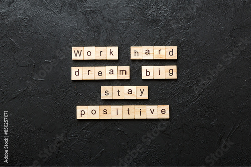 Φωτογραφία Work hard dream big stay positive word written on wood block