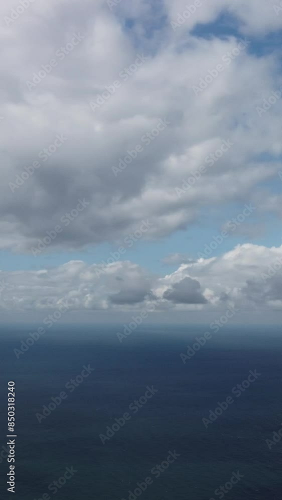 Aerial vertical view. Dramatic moody and gloomy rain clouds over sea. Abstract aerial nature summer ocean sunset sea and sky. Horizon. Vacation, travel and holiday concept. Weather and climate change Aerial vertical view. Dramatic moody and gloomy rain clouds over sea. Abstract aerial nature summer ocean sunset sea and sky. Horizon. Vacation, travel and holiday concept. Weather and climate change