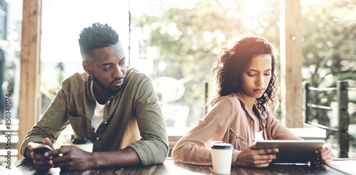 Fotografie Fight, tech and angry couple at a cafe with phone, tablet or argument, ignore and commitment doubt