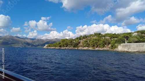 Scenic view of the Elafiti Islands in Croatia with blue waters and a lush green coastline photo