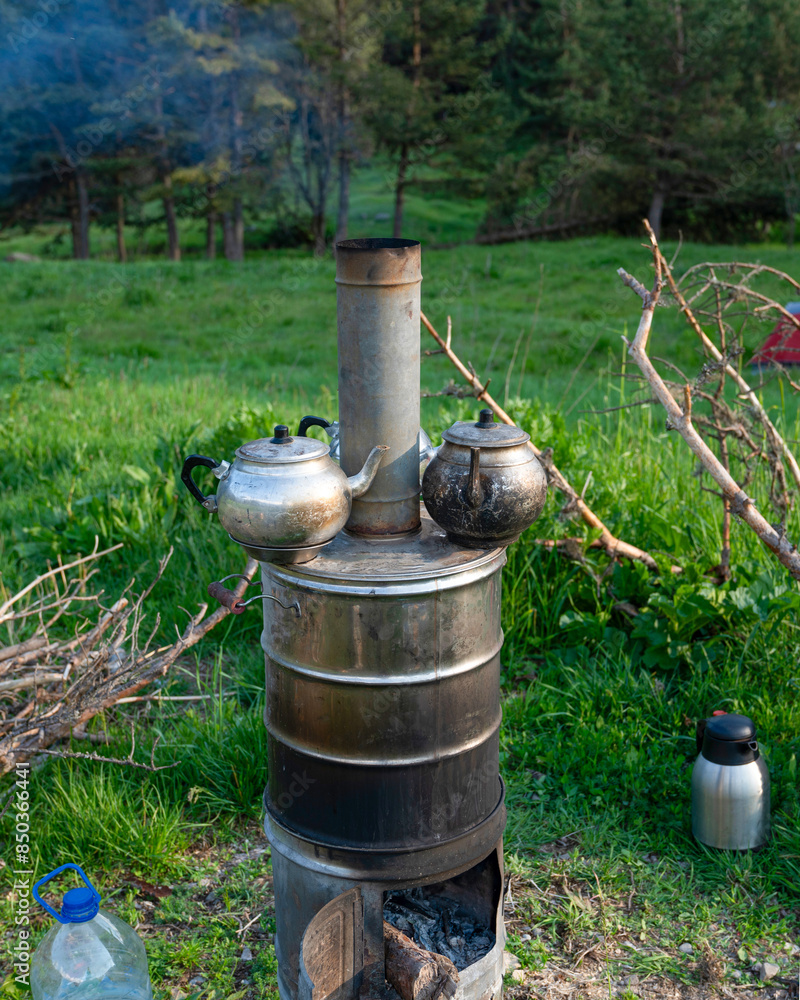 Camp samovar in forest. Turkish tea is being preparing. Camp samovar in forest. Turkish tea is being preparing.