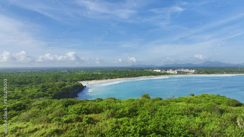 Drone retreating to reveal a secluded cove and its beachfront in the Dominican Republic, one of the Caribbean islands. Drone retreating to reveal a secluded cove and its beachfront in the Dominican Republic, one of the Caribbean islands.
