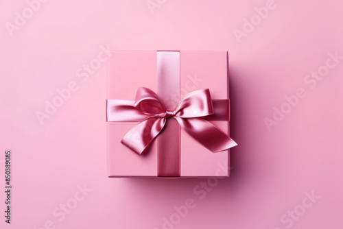 a pink gift box with a bow © Paula