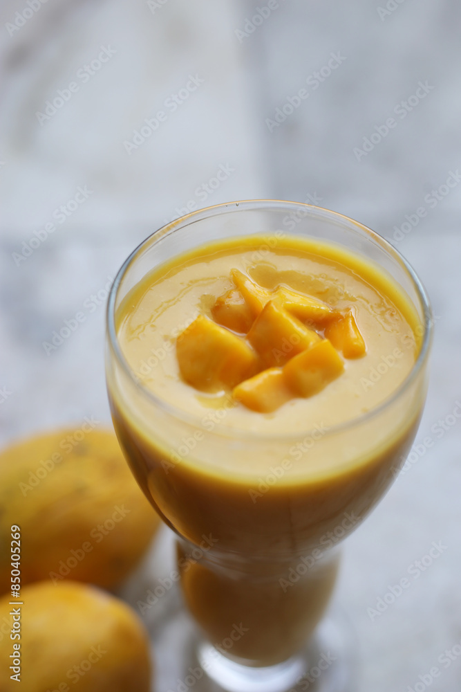 Isolated mango collection. Thai yellow mango fruits of different shapes, pieces and leaves isolated on marbel background Photo alphonso mango or hapoos aam is a seasonal and juicy fruit from india Isolated mango collection. Thai yellow mango fruits of different shapes, pieces and leaves isolated on marbel background Photo alphonso mango or hapoos aam is a seasonal and juicy fruit from india