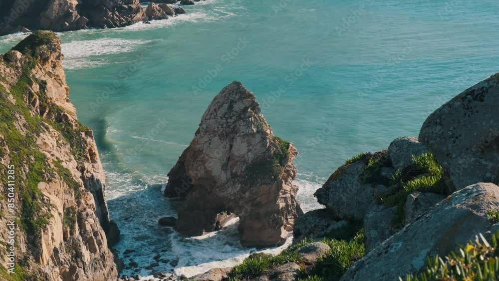 Massive mountain stone rocks sticking out from the sea ground. Atlantic ocean rocky and sandy coastline with clean water Tropical relaxing paradise nature summer landscape shot with green, blue waves Massive mountain stone rocks sticking out from the sea ground. Atlantic ocean rocky and sandy coastline with clean water Tropical relaxing paradise nature summer landscape shot with green, blue waves