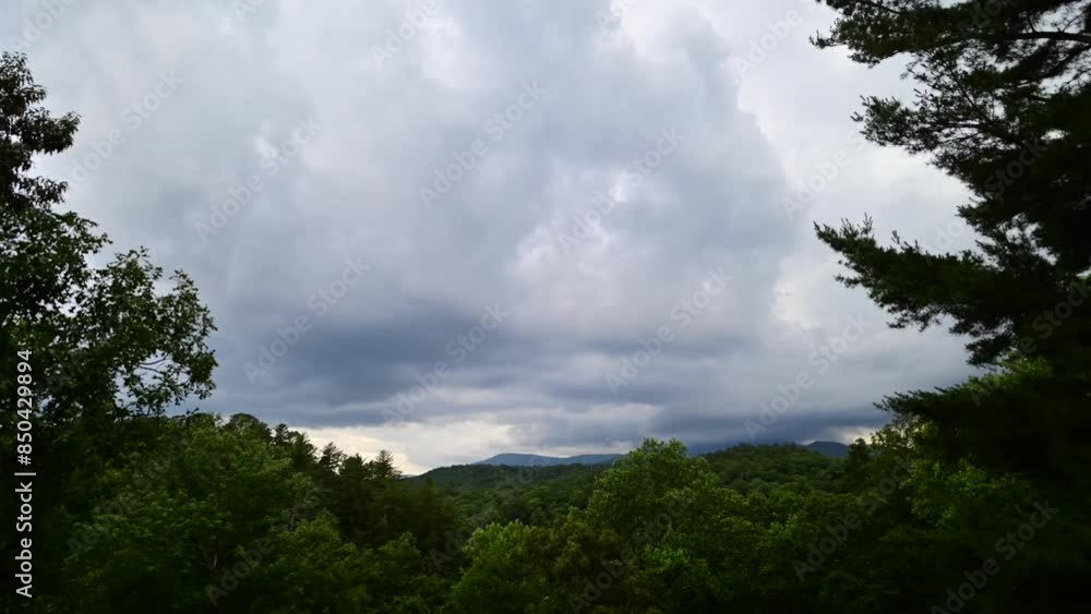 Incoming early summer violent storm coming through the mountains, time lapse Incoming early summer violent storm coming through the mountains, time lapse
