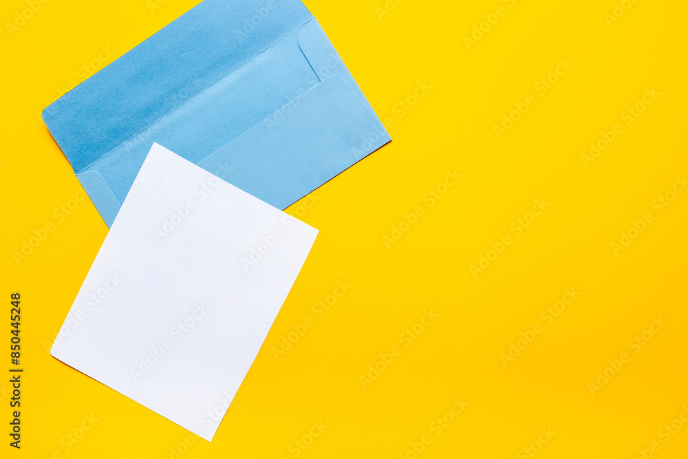 Blank sheet of paper on an envelope for letters. Space for text, top view Blank sheet of paper on an envelope for letters. Space for text, top view