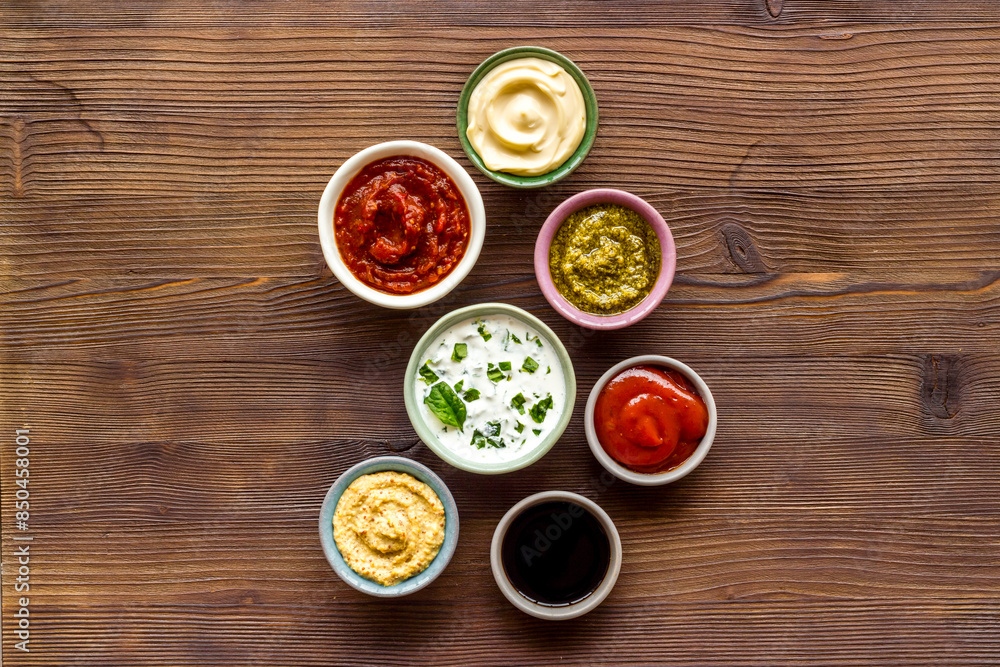 Set of sauces in bowls - pesto salsa mustard and others. Food background Set of sauces in bowls - pesto salsa mustard and others. Food background