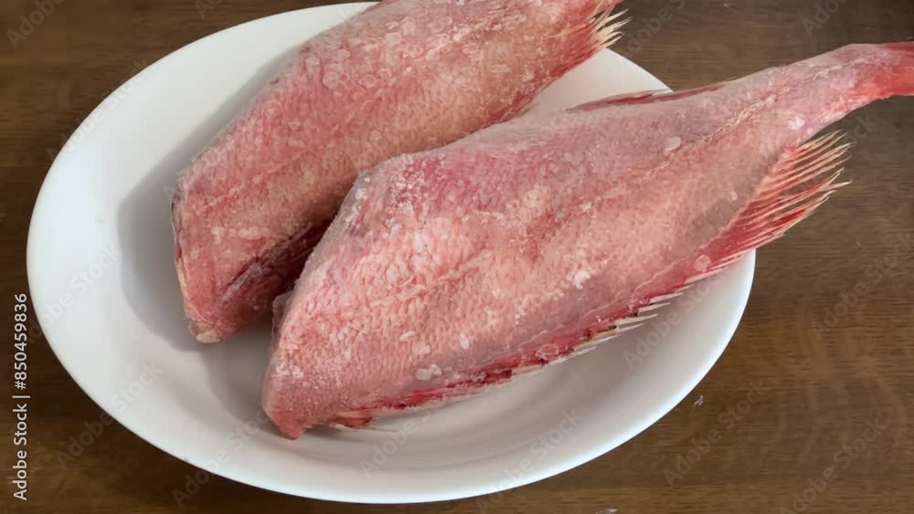 Two frozen redfish carcasses without heads covered with hoarfrost Two frozen redfish carcasses without heads covered with hoarfrost