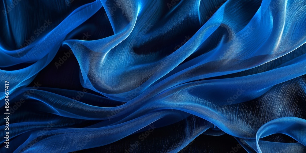 Obraz premium Close-up of Blue Fabric Texture, a Dark and Moody Background. This captivating image showcases the intricate texture of a blue fabric, captured in a close-up shot against a dark background.creating a 