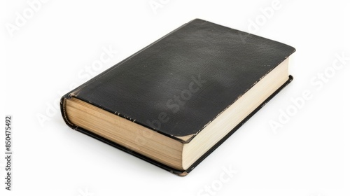 Isolated white background featuring a solitary black hardcover book © TheWaterMeloonProjec