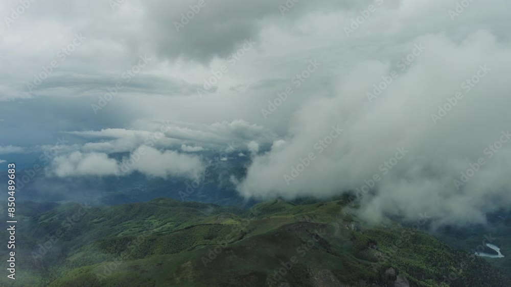 Aerial view of clouds over summer green mountains landscape, Montenegro, 4k
Aerial view of clouds over summer green mountains landscape, Montenegro, 4k