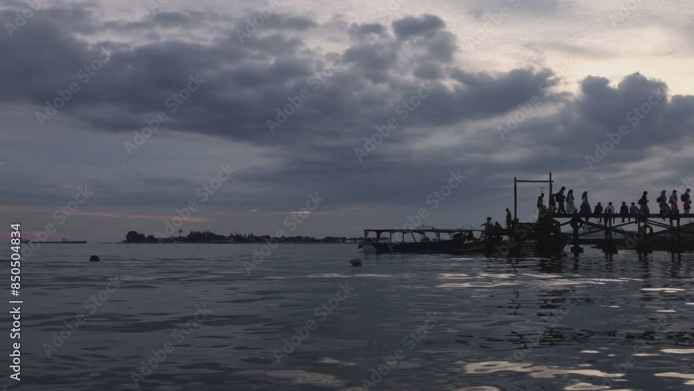 Time lapse of activities at a wooden traditional pier in the afternoon Time lapse of activities at a wooden traditional pier in the afternoon