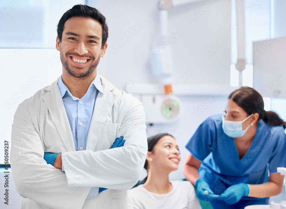 Portrait, dentist and nurse for oral health, dental care and hygiene in office or consultation in clinic. Man, arms crossed and smile as medic or doctor in hospital for treatment of teeth or mouth Portrait, dentist and nurse for oral health, dental care and hygiene in office or consultation in clinic. Man, arms crossed and smile as medic or doctor in hospital for treatment of teeth or mouth