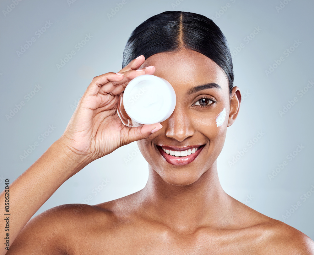 Product, skincare and Indian woman with hand and cream, beauty or studio on white background. Female person, face and eye with lotion wellness for moisturizing smile or dermatology, health or glow Product, skincare and Indian woman with hand and cream, beauty or studio on white background. Female person, face and eye with lotion wellness for moisturizing smile or dermatology, health or glow