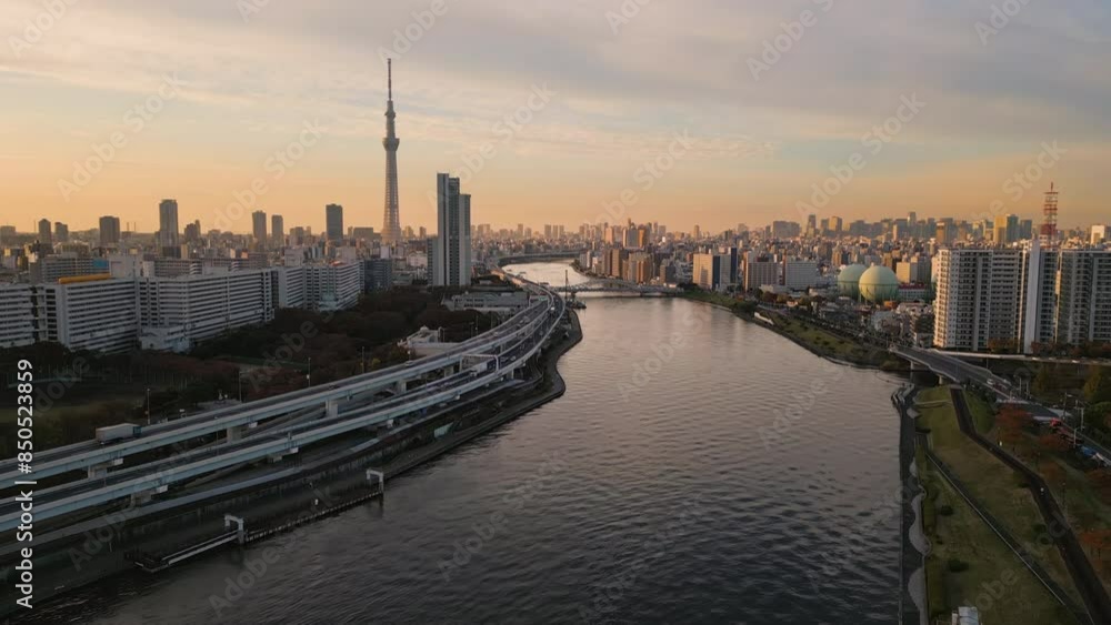 tokyo city skyline aerial view drone skytree tower district from arakawa river at sunrise,big highway on riverside tokyo city skyline aerial view drone skytree tower district from arakawa river at sunrise,big highway on riverside