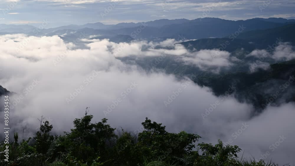 The sea of clouds slowly dispersed, revealing the sapphire blue lake water. View of the mountains surrounding Emerald Reservoir. Xindian District, Taiwan. The sea of clouds slowly dispersed, revealing the sapphire blue lake water. View of the mountains surrounding Emerald Reservoir. Xindian District, Taiwan.