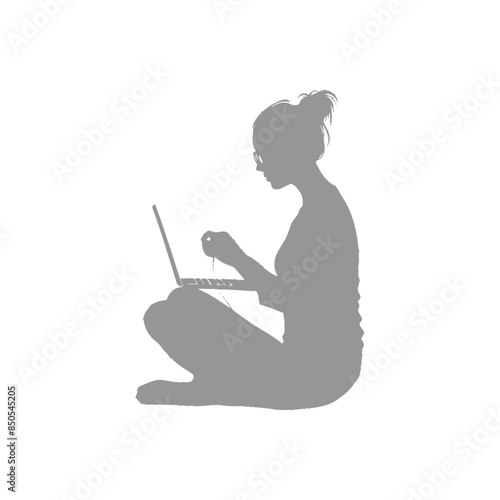 silhouette elderly woman playing on laptop while sitting cross legged