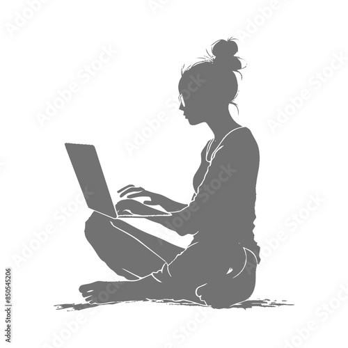 silhouette elderly woman playing on laptop while sitting cross legged