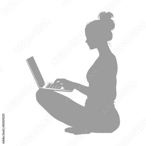 silhouette elderly woman playing on laptop while sitting cross legged