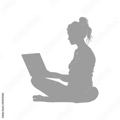 silhouette elderly woman playing on laptop while sitting cross legged