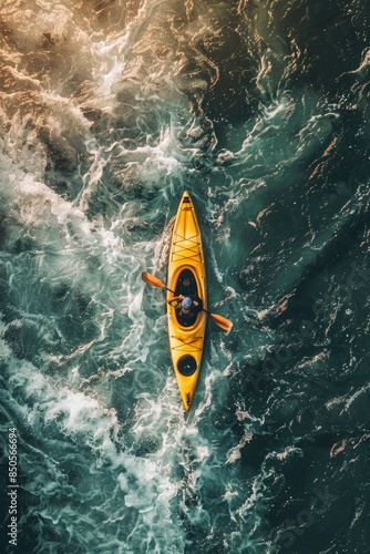 A person paddling a yellow kayak on calm ocean waters, with a sunny day and clear blue sky