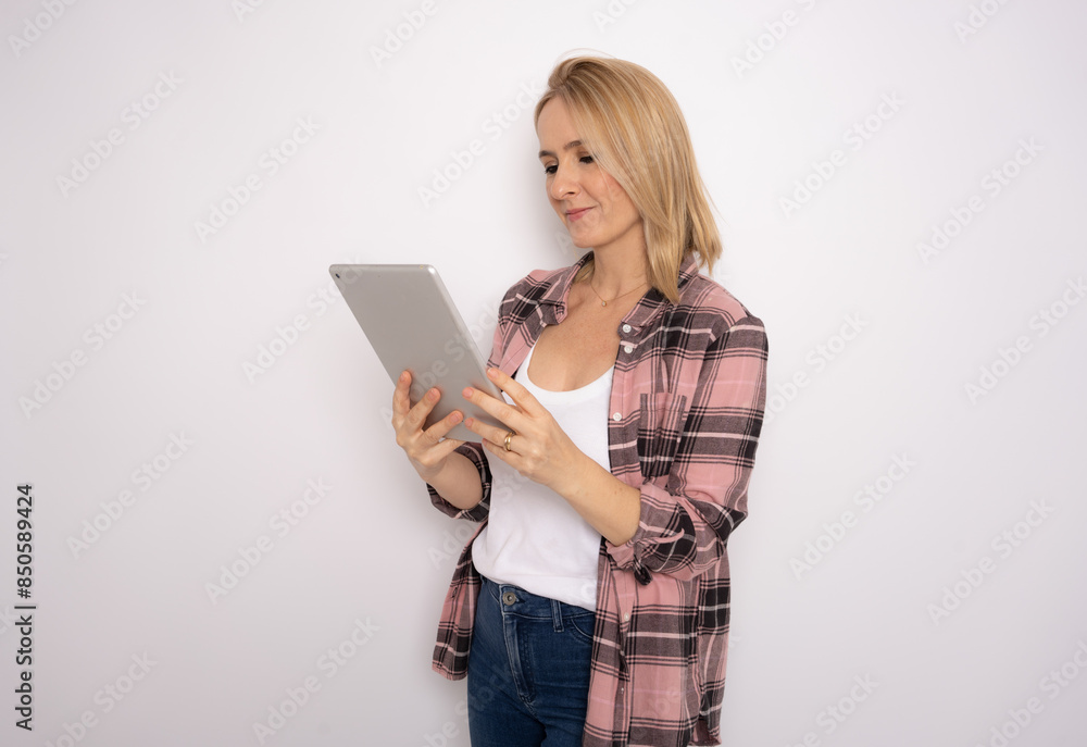 Happy woman using laptop computer isolated on a white Happy woman using laptop computer isolated on a white
