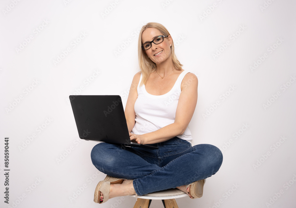 Attractive young caucasian woman sitting on a chair isolated on white background. Attractive young caucasian woman sitting on a chair isolated on white background.