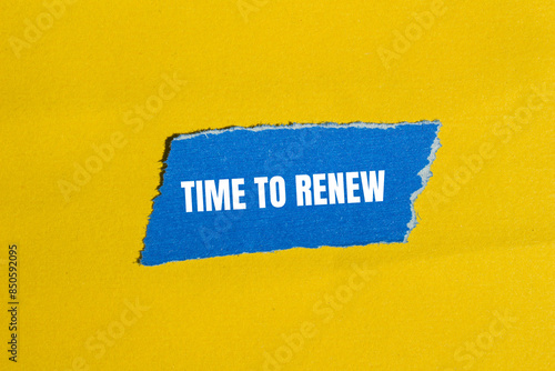 Time to renew message written on ripped blue paper piece with yellow background. Conceptual time to renew symbol. Copy space.
