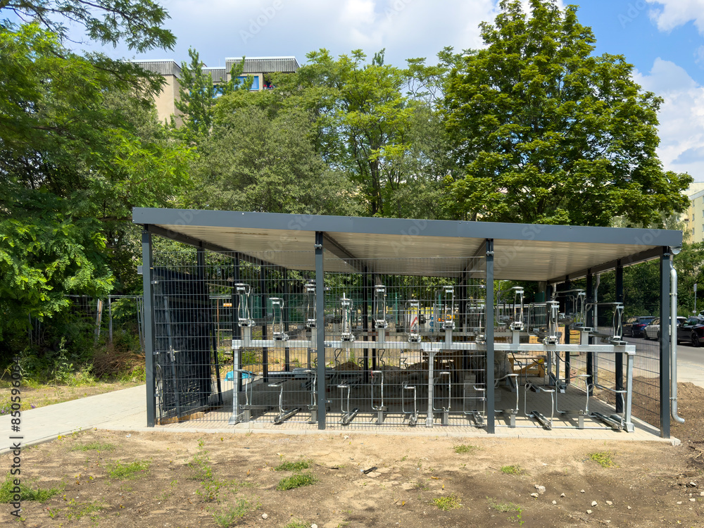 View of an almost completed bicycle garage being built in a residential area in Berlin. View of an almost completed bicycle garage being built in a residential area in Berlin.