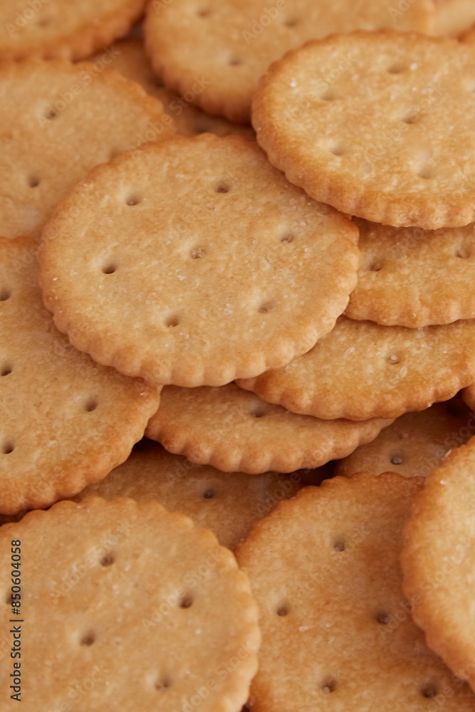Saltine crackers close up vertical shot, close up cookies, fresh cookies