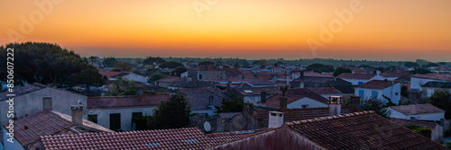 Rooftops and houses of the village of La Cotinière in Saint-Pierre-d'Oléron, France at sunset