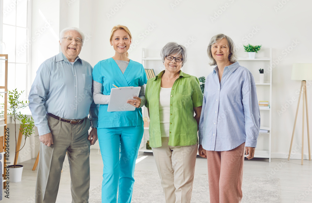 Portrait of a happy caregiver with a group of positive senior patients in a nursing home. Warmth and care to elderly residents, highlighting the importance of compassionate nursing and support.