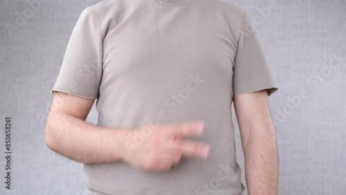 Wallpaper Mural man showing two finger sign Torontodigital.ca