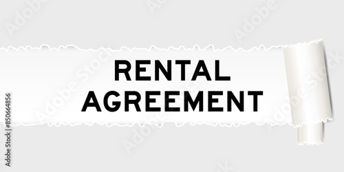 Ripped gray paper background that have word rental agreement under torn part