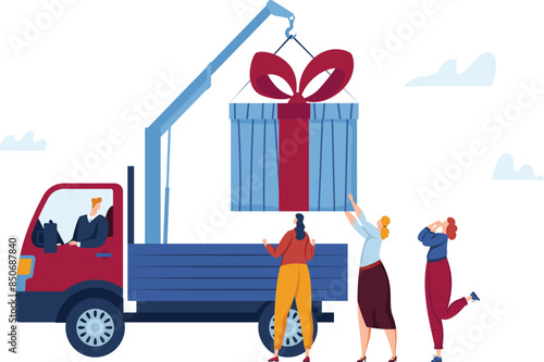 Large gift delivery concept crane lifting huge present red ribbon blue wrapping. Driver operating truck women excited big surprise outdoors. Celebration event special delivery oversized box blue red