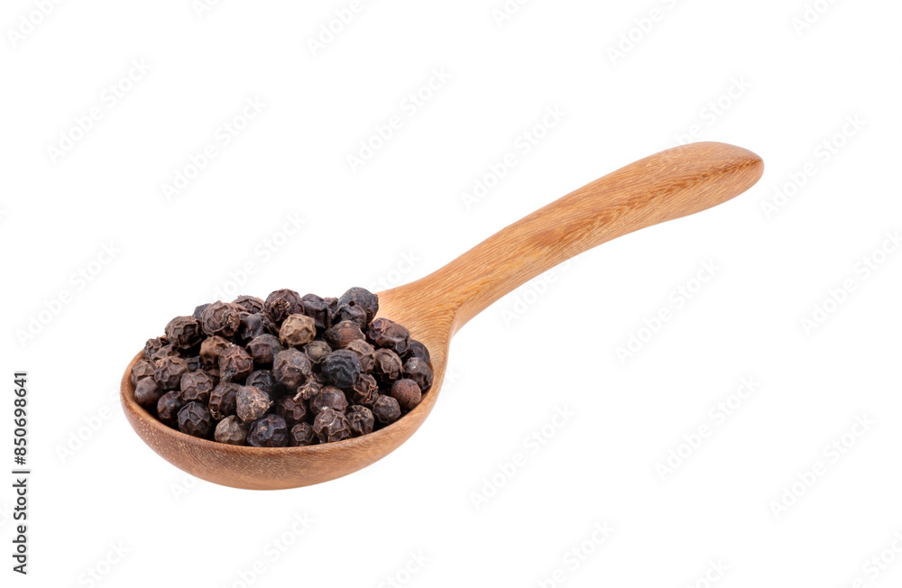 Black pepper corns in wood spoon isolated on white background Black pepper corns in wood spoon isolated on white background