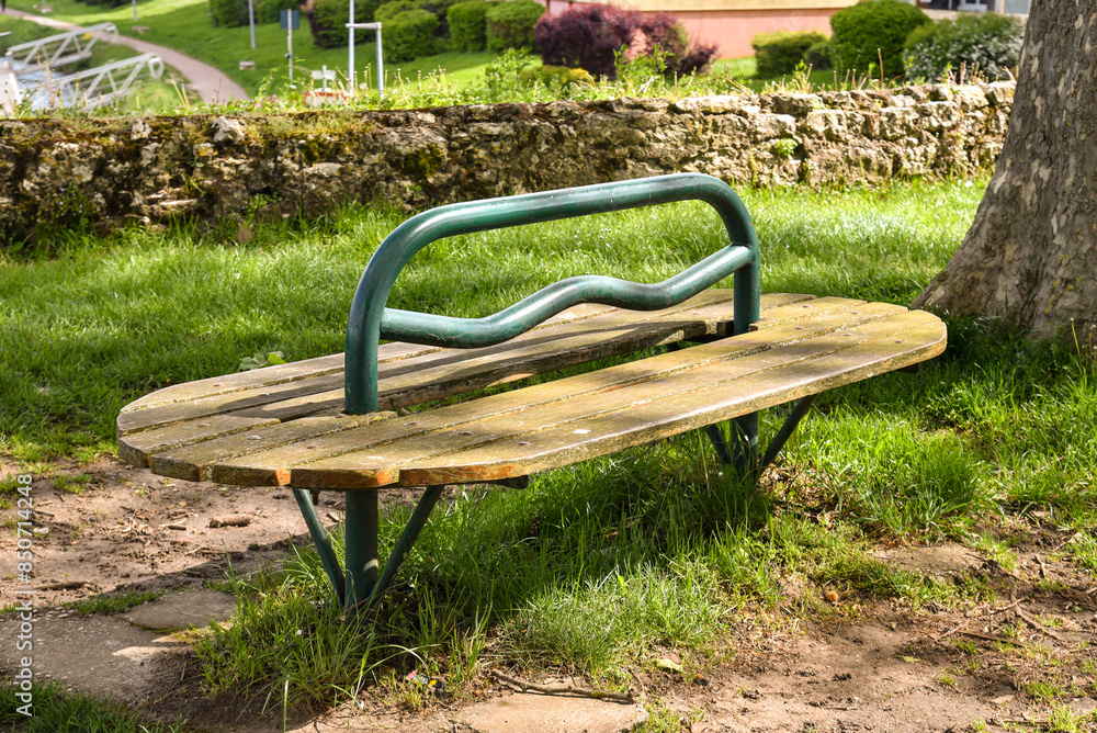 Old bench in a public park in france