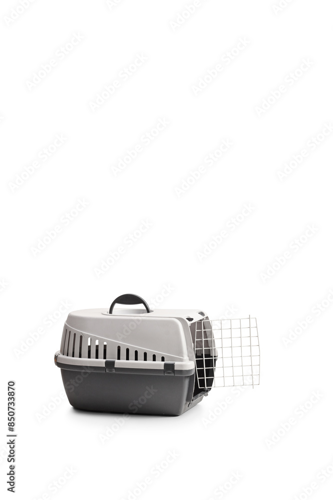 Studio shot of a portable pet carrier with an open door Studio shot of a portable pet carrier with an open door