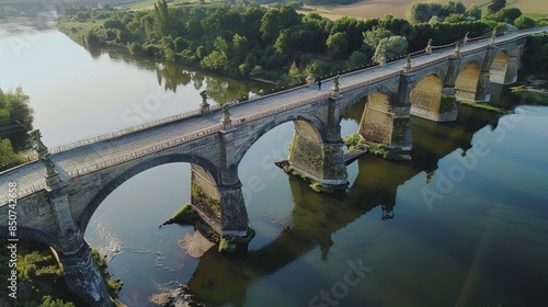 Wallpaper Mural Aerial shot of a historic bridge spanning a river, emphasizing its arches and intricate details Torontodigital.ca
