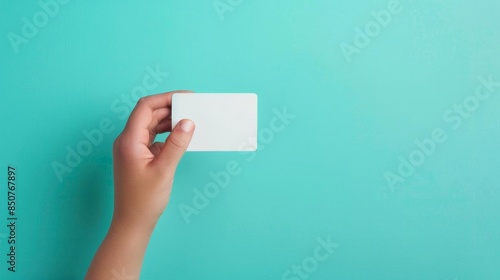 Closeup shot of a hand holding a sleek credit card