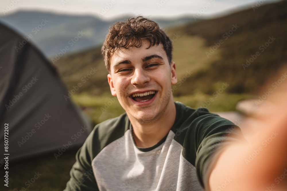 Self portrait of young boy stand on the mountain and have fun Self portrait of young boy stand on the mountain and have fun