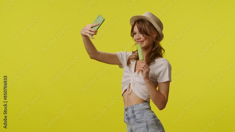 Young woman in casual clothing with ice cream taking selfie on smartphone. Travel, summertime vacation, tourism leisure time concept. Young woman in casual clothing with ice cream taking selfie on smartphone. Travel, summertime vacation, tourism leisure time concept.