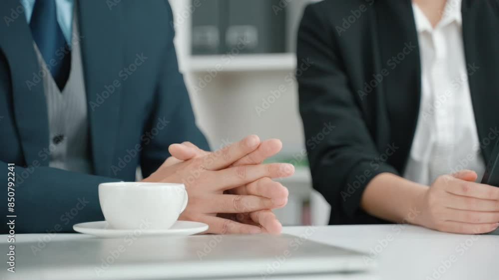Close-up, the hands of a stressed-out businessperson attending a meeting.
Close-up, the hands of a stressed-out businessperson attending a meeting.
