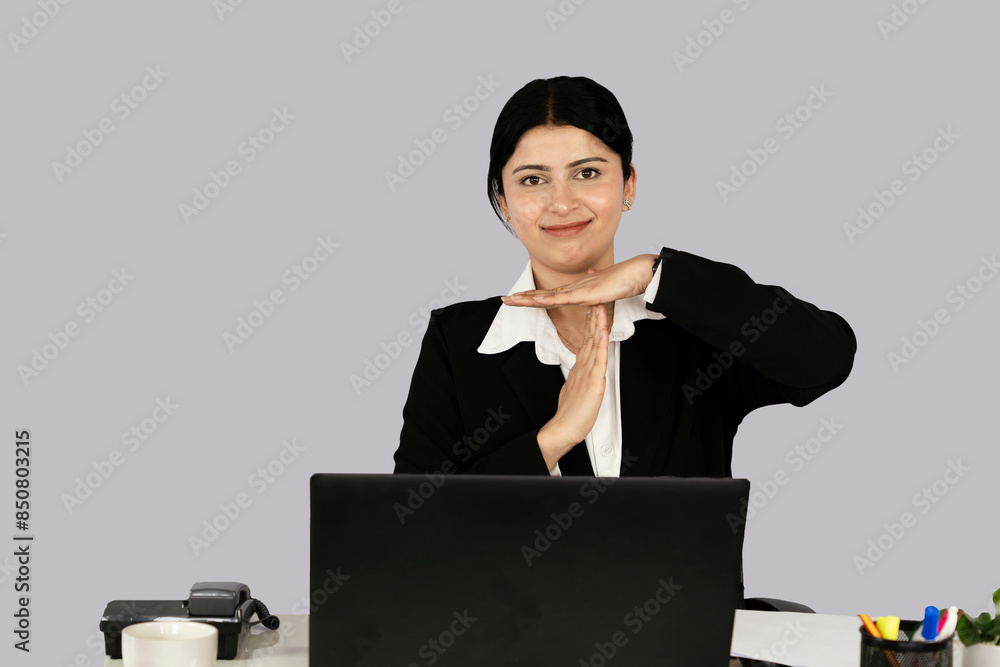 Beautiful Asian Indian Receptionist Entrepreneur with laptop, headphone and diary gives gestures and expressions Beautiful Asian Indian Receptionist Entrepreneur with laptop, headphone and diary gives gestures and expressions