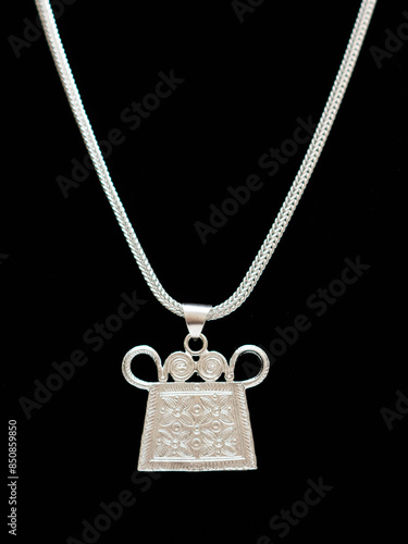 Handmade Hmong or Miao silver jewelry display on white background